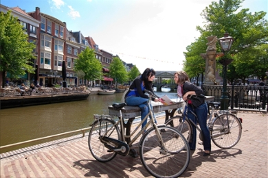 Students at one of Leiden's canals