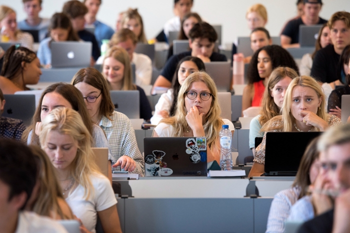 Students in a lecture hall at Leiden Law School.