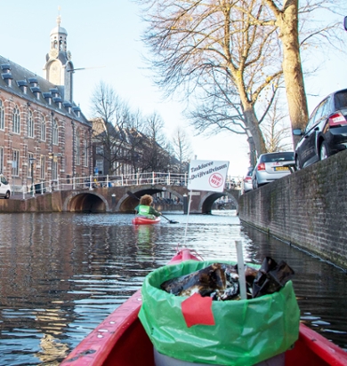 Cleaning plastic waste from the canals in Leiden.