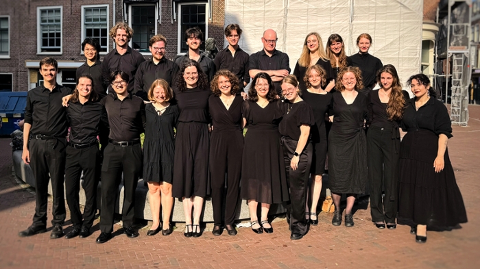 A group of people dressed in black.