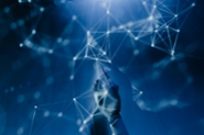 Abstract image of a robotic hand pointing to a node in a network of interconnected white dots.