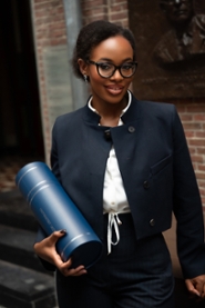 Mariam Basajja poses with her doctoral diploma in the Academy Building after defending her dissertation.